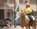 Woman on horseback for 4H in a parade in small town America Royalty Free Stock Photo