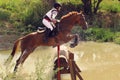 Woman horseback jumping