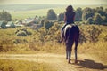 Woman during horseback riding.