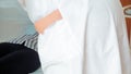 A woman in a hospital undergoing UV blood irradiation therapy