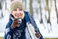 Woman with hot tea or coffee on a winter hike