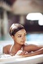 Woman, hot tub and spa relax at vacation resort with thinking of stress relief, holiday or travel. Female person Royalty Free Stock Photo