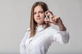 Woman with hourglass, white shirt, time warning