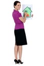 Woman with a house energy rating sign Royalty Free Stock Photo