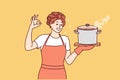 Woman housewife or cook with soup pan shows ok gesture and looks at screen smiling