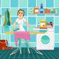 Woman housewife iron clothes on an ironing board in bathroom. Royalty Free Stock Photo