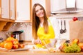 Woman housewife in kitchen cutting apple fruits Royalty Free Stock Photo