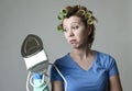 Woman or housewife sad bored and stressed holding iron angry and frustrated Royalty Free Stock Photo