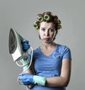 Woman or housewife sad bored and stressed holding iron angry and frustrated Royalty Free Stock Photo