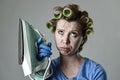 Woman or housewife sad bored and stressed holding iron angry and frustrated Royalty Free Stock Photo