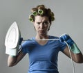 Woman or housewife sad bored and stressed holding iron angry and frustrated Royalty Free Stock Photo