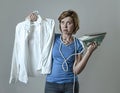 Woman or housewife sad bored and stressed holding white shirt an