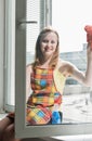 Woman housewife washes a window