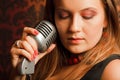 Woman hugged hand vintage microphone Royalty Free Stock Photo