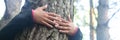 Woman hugging a big tree in a park. Royalty Free Stock Photo