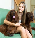 Woman hugging dogs Royalty Free Stock Photo