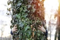 Woman hugging the tree. Love nature and ecology concept. Royalty Free Stock Photo