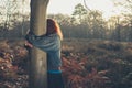 Woman hugging tree at sunset Royalty Free Stock Photo