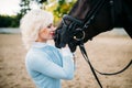 Woman hugs her horse, friendship, horseback riding Royalty Free Stock Photo