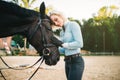 Woman hugs her horse, friendship, horseback riding Royalty Free Stock Photo