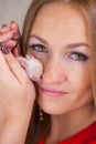 A woman hugs a newborn rat. Portrait of a beautiful girl with a mouse Royalty Free Stock Photo