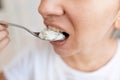 the woman is hungry and therefore eats rice with spoons Royalty Free Stock Photo