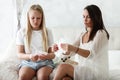 Woman hygene concept. Periods. Menstrual cycle. Mother explains daughter how to use hygiene pads and tampons. Woman and