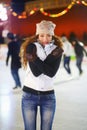 Woman, ice rink and portrait on cold night with self hug, training and exercise on winter holiday. Young girl, skate and Royalty Free Stock Photo