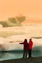 Woman in Iceberg lagoon jokulsarlon on the south of Iceland. Toned Royalty Free Stock Photo