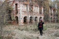 A woman in the image of Baron Saturday poses against the backdrop of an old ruined brick building. The model is wearing Royalty Free Stock Photo