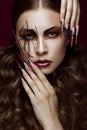 Woman in the image of spider with creative art makeup and long nails. Manicure design, beauty face.