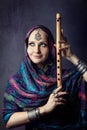 Woman with Indian flute Royalty Free Stock Photo