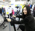 Woman in Indoor bycicle cycling in gym. Competition, caucasian. Royalty Free Stock Photo