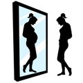 Woman infertility. Expectant mother. Woman in front of a big mirror, sees a reflection of a pregnant girl. Desire to get pregnant Royalty Free Stock Photo