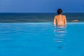 Woman in the infinity pool