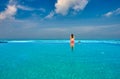 Woman in infinity swimming pool at Maldives Royalty Free Stock Photo