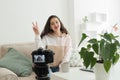 Woman influencer recording herself on camera at home Royalty Free Stock Photo