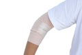 Woman injured her elbow first aid is wrapped with elastic bandage to prevent musculoskeletal movements.
