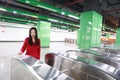 Woman insert ticket to ticket entrance train station