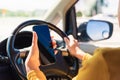 Woman inside a car and using a hand holding mobile smartphone Royalty Free Stock Photo