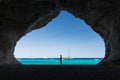 Woman inside a cave at Cala Luna beach Royalty Free Stock Photo