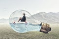 Woman inside light bulb Royalty Free Stock Photo