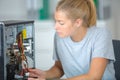 Woman inspecting the motherboard Royalty Free Stock Photo