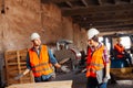 The woman inspector checks the work of a man in a warehouse Royalty Free Stock Photo