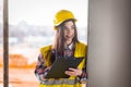 Woman inspects the buildings process at a construction site