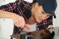 woman installing induction hobs in kitchen Royalty Free Stock Photo