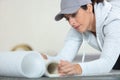 woman installing roll flooring