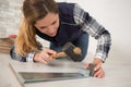 Woman installing wood floor Royalty Free Stock Photo