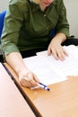 Woman intently reading the documents