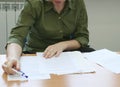 Woman intently reading the documents (front) Royalty Free Stock Photo